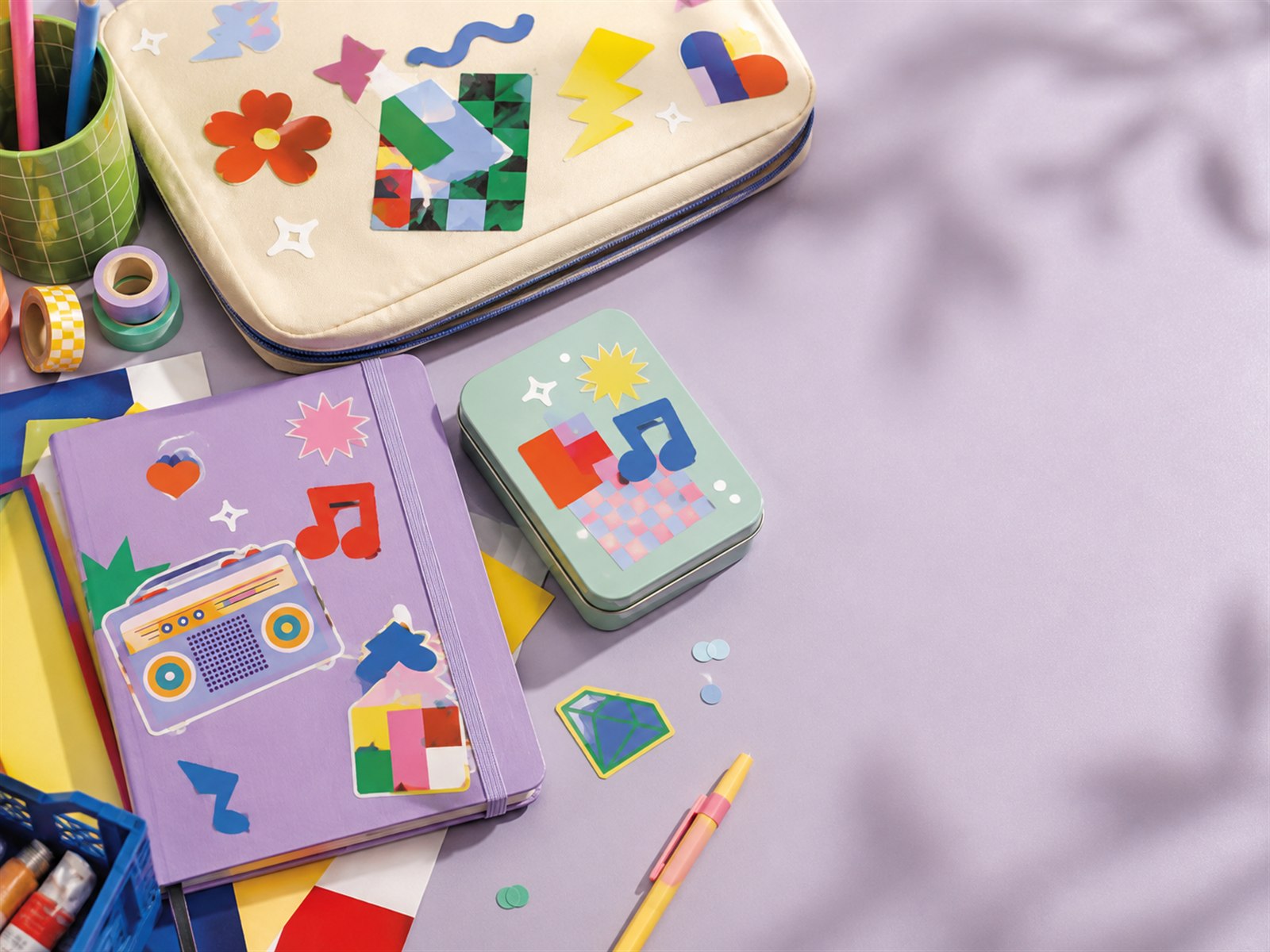Playful SHANLE LAB sticker mix arranged on a colorful notebook and desk
